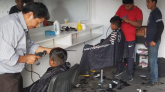 The boys getting a haircut, San Mateo, Bolivia