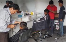 The boys getting a haircut, San Mateo, Bolivia