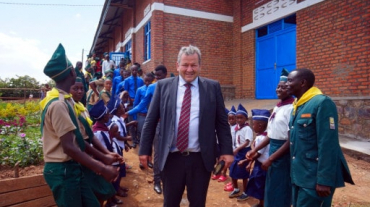 First chairman Gerhard Hermann in front of the new multipurpose hall